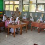 Bhabinkamtibmas Memonitor Pendistribusian Makan Bergizi Gratis (MBG) di Sekolah Dasar Kota Bima